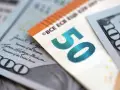 Euro i dolary, kurs wymiany. 50 euro obok 100 dolarów.