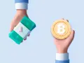 Dwie dłonie: jedna trzyma stos banknotów, druga monetę bitcoin. Dowiedz się, jak sprzedać bitcoin bez podatku.