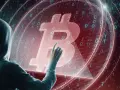 Osoba w kapturze dotyka symbolu Bitcoina na tle kodu binarnego. Czy to ślad po majątku Satoshi Nakamoto?