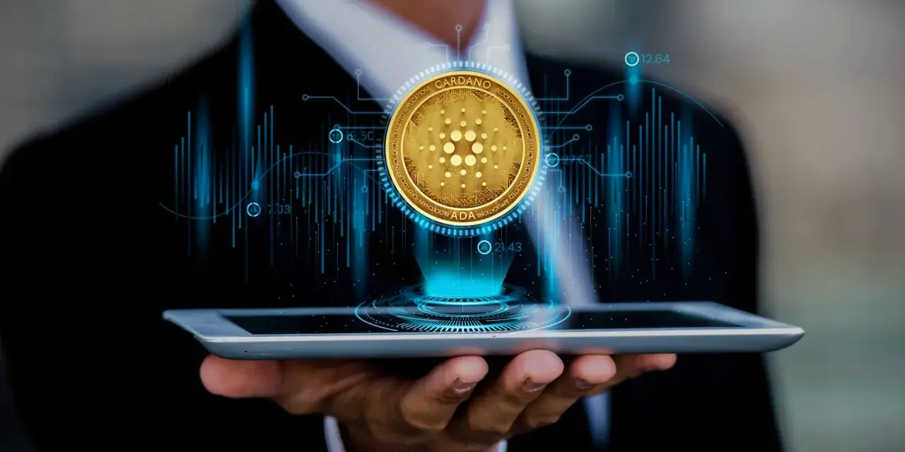 Biznesmen analizuje kurs Cardano (ADA) na tablecie, widząc wykresy i dane.