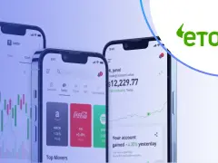 Trzy smartfony prezentujące aplikację eToro z wykresami giełdowymi i informacjami o inwestycjach. Sprawdź eToro opłaty przed rozpoczęciem handlu.