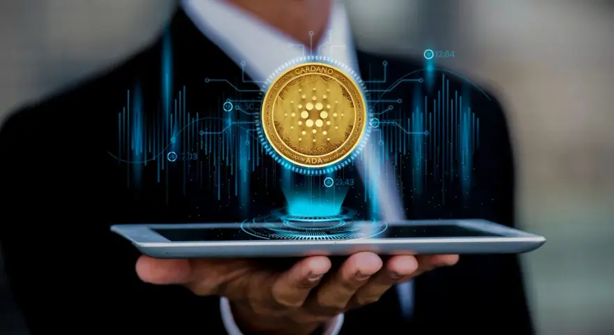 Biznesmen analizuje kurs Cardano (ADA) na tablecie, widząc wykresy i dane.